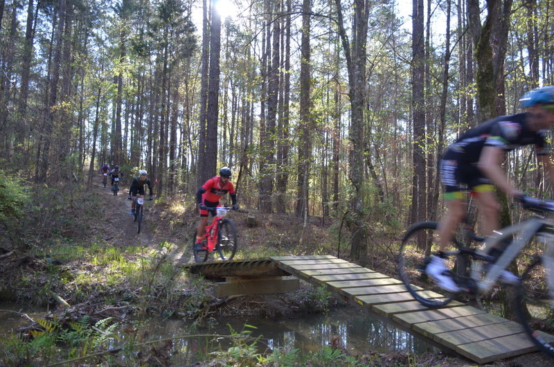 racing over the Big Enoch creek jump