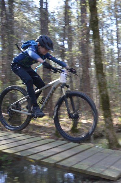 nice flying form over the Big Enoch Creek Jump by one of the younger racers...