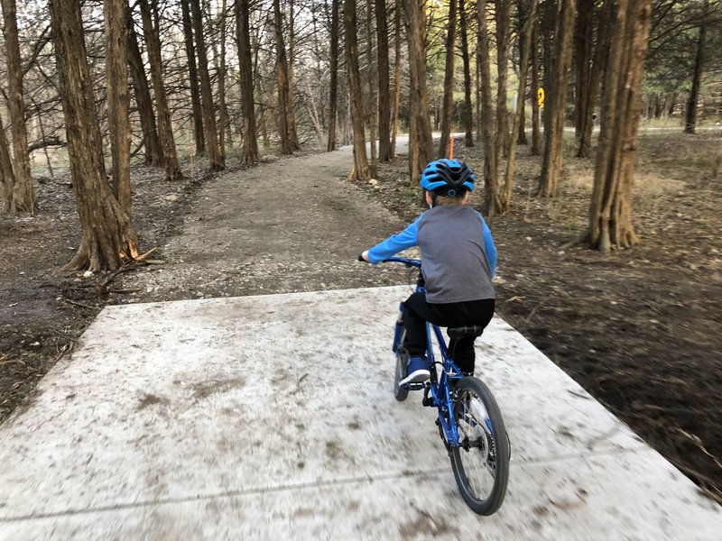 This area of the trail intersects with several walking only trails, watch the signs to be sure you stay on the bike path