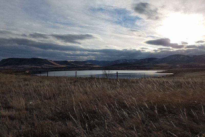 From Ralston Creek Trail towards North Table Mountain and Golden over Blunn Reservoir.