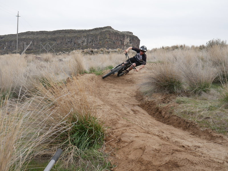 Hitting a berm on the flow trail