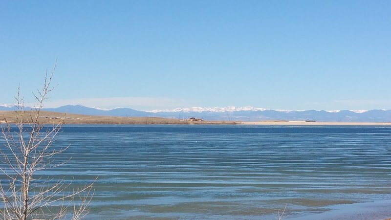 Looking across Aurora Reservoir toward the snow-capped summits of the Indian Peaks Wilderness.