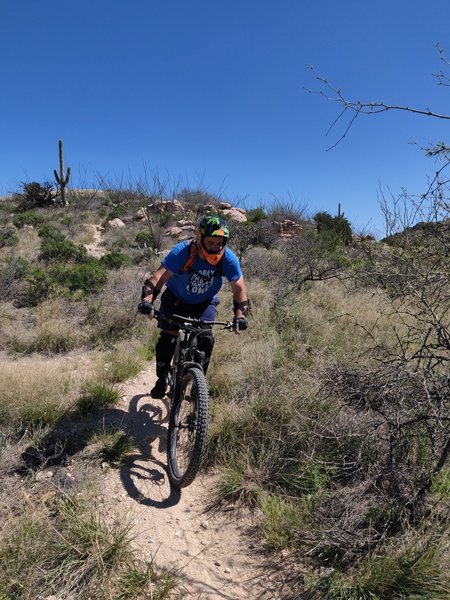 Shredding one of the easier portions of this rugged trail.