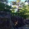 This boulder outcrop offers a peek at Rich Mountain.