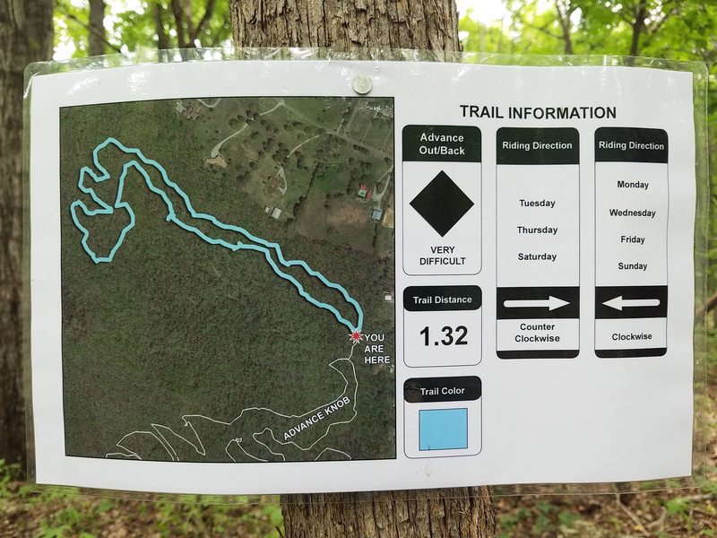 Laminated map tacked to a tree. Riding direction is CCW on Tues, Thurs, and Sat. Clockwise on Mon, Wed, Fri, and Sun.