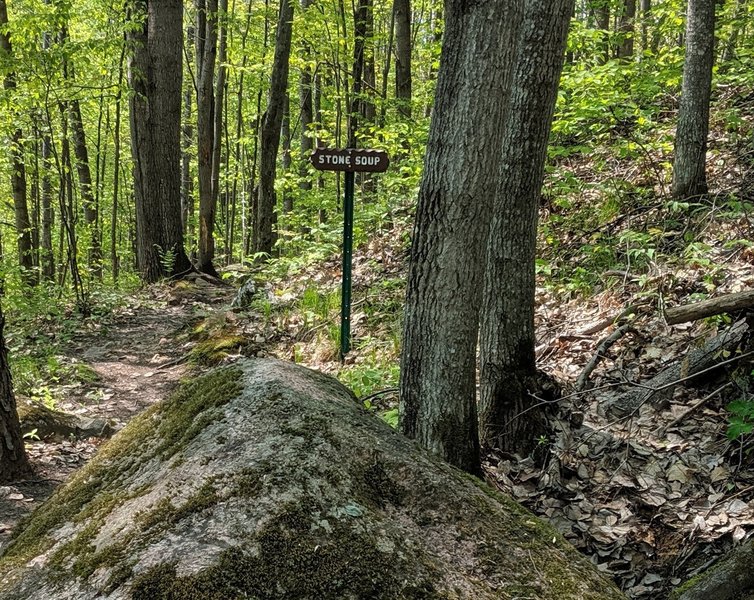 Ride around the boulder to the right and your in Stone Soup.