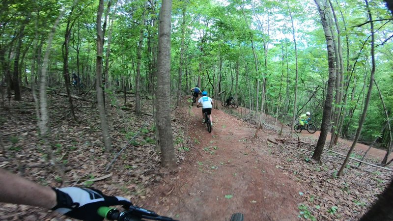 Training the triple switchback berms on Roaster Coaster in Cedar Valley Bike Park in Davidson, NC.