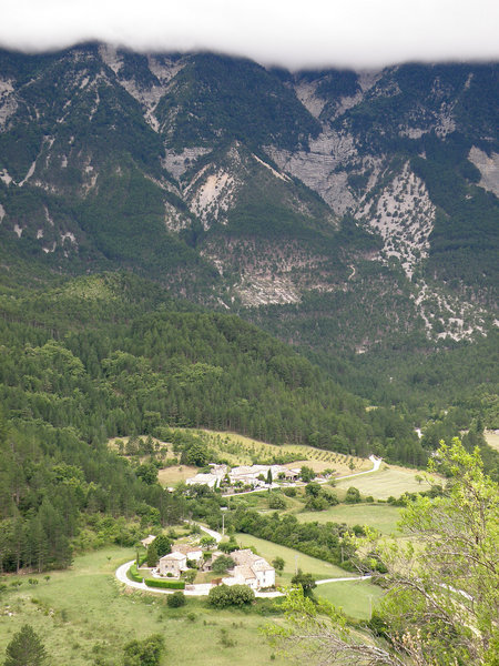 The imposing and less-viewed north face of Mont Ventoux and the hamlets of La Frache and Les Bernard seen from Brantes. Ventoux summit obscured by clouds.