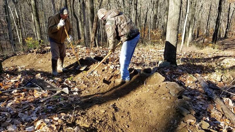 Shaping a berm.