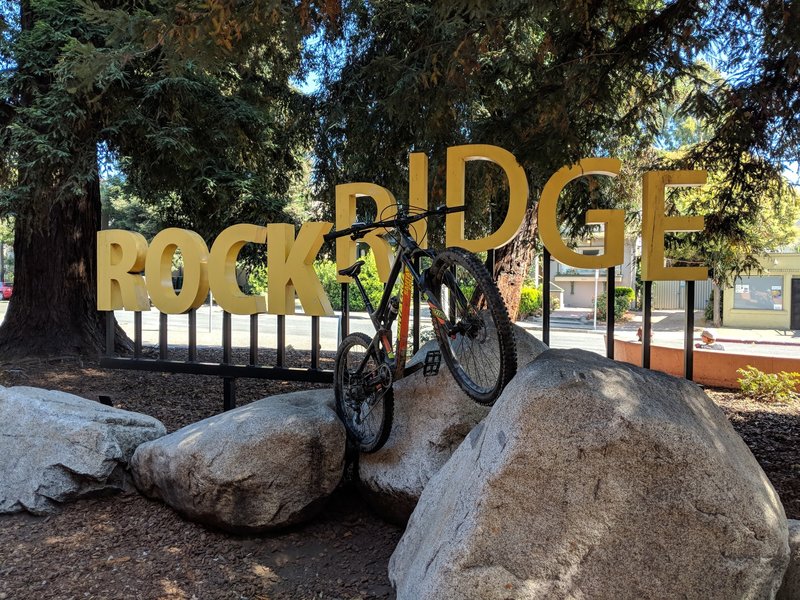 Mountain bike in front of the sign outside Rockridge BART station. Where a lot of fun begins!