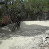 Rider exiting from one of the berms along Recluse.