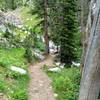 Trail crosses South French Creek via a narrow foot bridge.