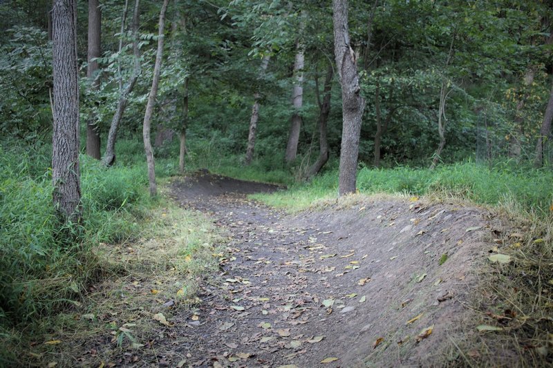 Two berms back-to-back can be ridden while pumping before continuing the descent.