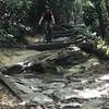 Lukas is biking down a rocky section.