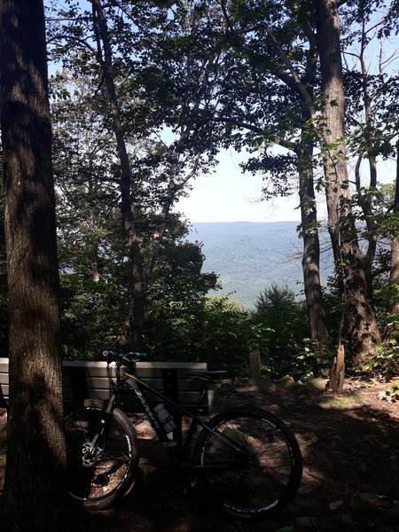 Scenic vista with a bench just after the decent.