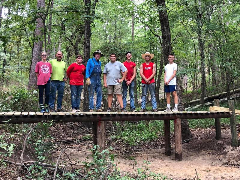 A local Boy Scout crew building a new bridge on Buzzard Hallow.