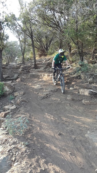 Scott clearing the rock garden and drops just before the jump line on the lower section of Venom