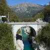 Napoleon-Bridge in Kobarid (Old Napoleon Road starts on the left side just below the banner).