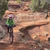 Curving around a slick rock bench.