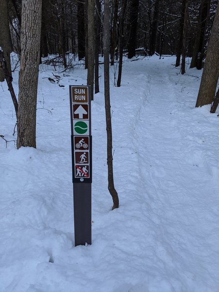 Looking north in winter on Sun Run Trail, heading clockwise on the loop.