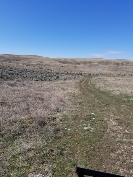 Road to follow to west and then up ridge.