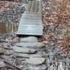 rock & boardwalk through standing wet area