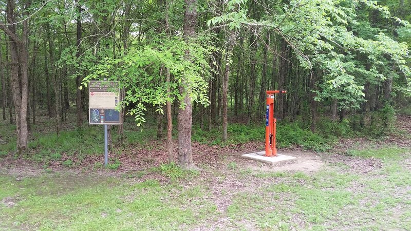 Trailhead sign and bike work stand.