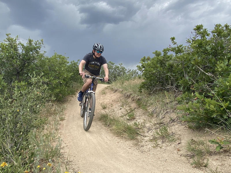 Austin taking a loose turn on a borrowed bike.