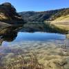 Reflecting off and looking through the water surface of the low lake line.