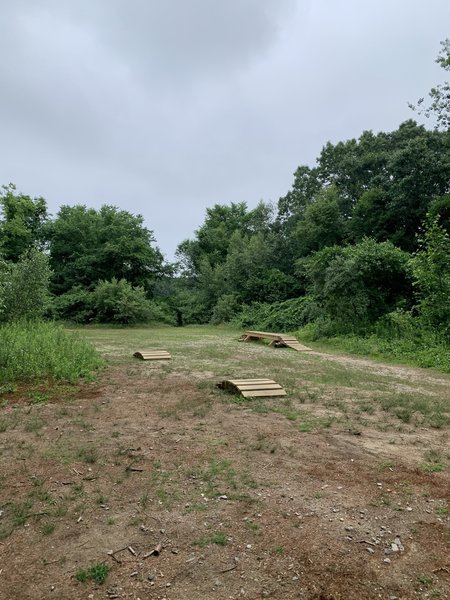 A small field near the soccer field with some practice features.