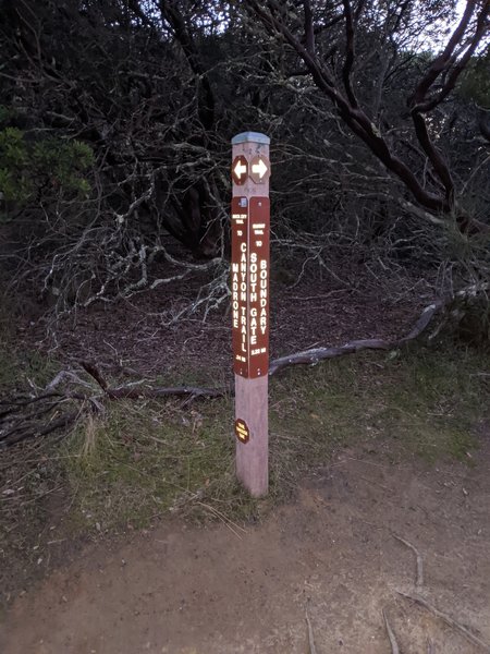 Sign post at the top of the Rock City segment of the Summit Trail (no no bikes symbol)