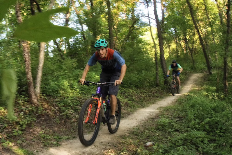 Riders enjoying some pumpy bench cut trail at Creekside.