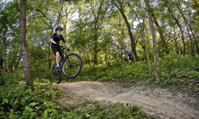 Youth rider launching a roller at Creekside.