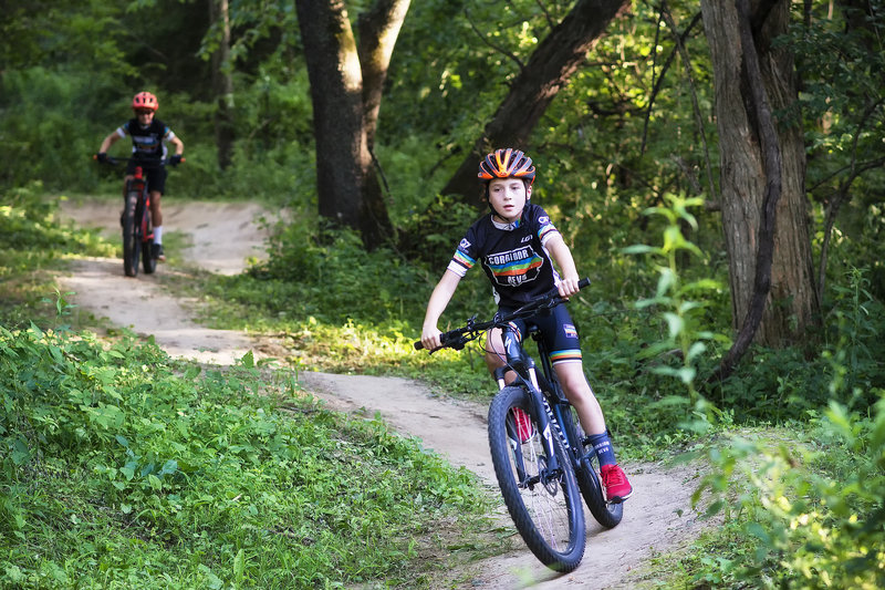 Youth riders enjoying some pumpy flow at Creekside.