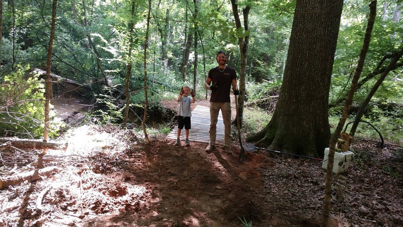 Completing the 20 foot bridge near the trailhead.