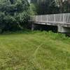 This is a closer shot of the entrance. Pass the tree on the left and hang right. You can see the trail under the sidewalk bridge on the left.