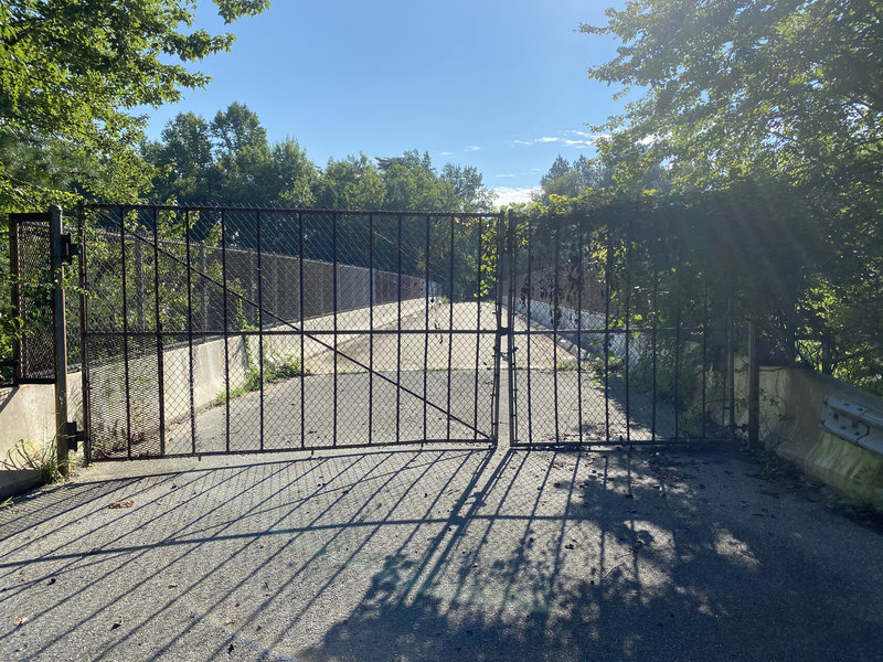 Gate blocking farm road