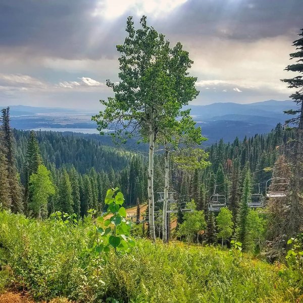 Lakes, trees, chairlift, and late summer clouds.