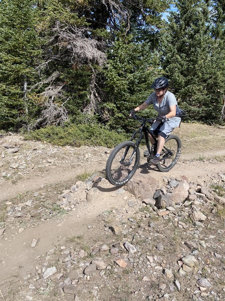 Managing a rock drop on the Color Flow trail.