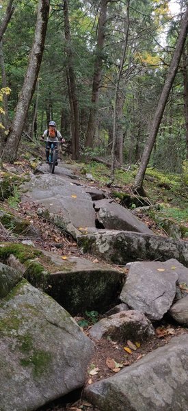 Riding the major rock garden on Dive Bomb