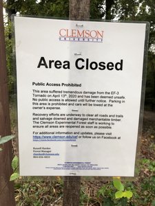 These signs are only at the road, not at the trailhead.