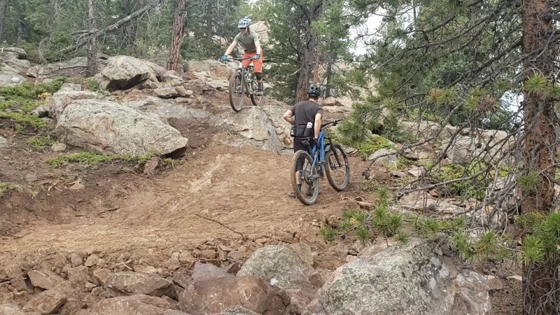 Decent three foot roller drop near the peak, our first two riders to go over it, just a few minutes after we finished the trail to the peak