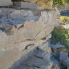 A side-on dinosaur track cut by the creek. The layers under the track bend down due to weight of the dinosaur