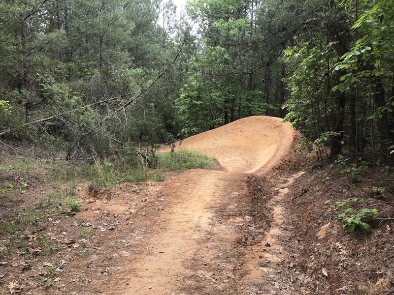 The first big berm on the DH trail.