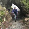 Riding through a natural rock arch