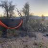 Bike packing in a hammock with a view of city lights
