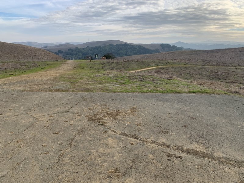 The Slab—asphalt area with picnic tables that is the top of the hill between Sugar City (through gate straight ahead) and Soaring Eagle trail that heads back to Cummings Skyway