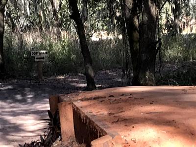 This is the last (third, I think) in a series of berms/bumps/table-tops [someone please correct my terminology, if it's wrong].  Note the sign in the background, indicating a loop-back so you can ride the feature over & over. :)