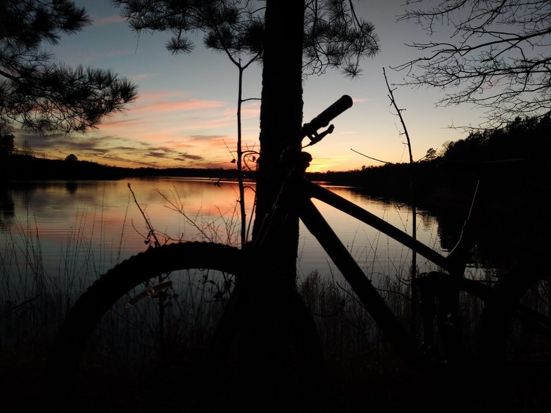 Bike silhouette view of the sunset from the East Trail.