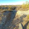 This is the south (northbound) entrance into a large wash. Off camber and varies based on rain and OHV use.